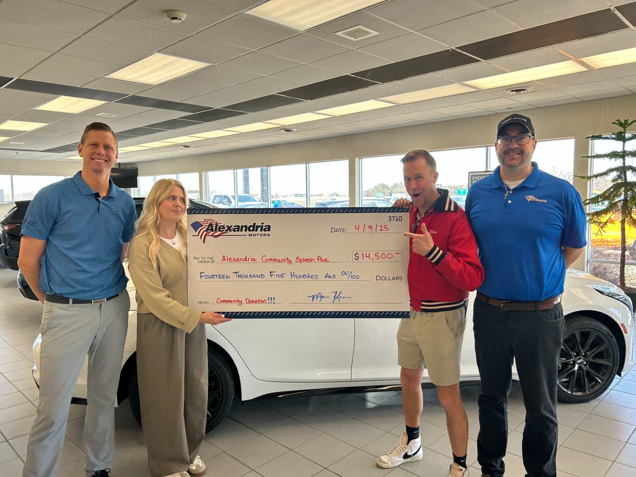 Alexandria Motors presenting a donation to the Alexandria Community Splash Pad